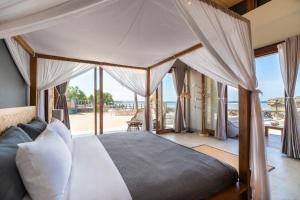 Postel nebo postele na pokoji v ubytování Manduna Resort