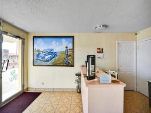 an office with a picture of a car on the wall at Route 66 Inn in Shamrock