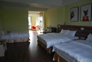 Sunny Sky Homestay客房内的一张或多张床位