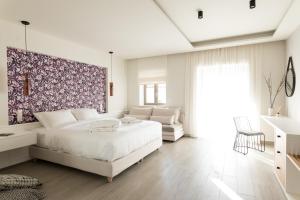 Posteľ alebo postele v izbe v ubytovaní Anemolia Parga Suites