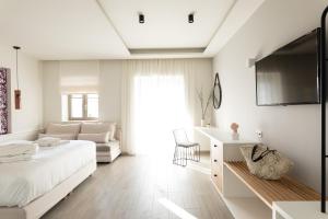 Posteľ alebo postele v izbe v ubytovaní Anemolia Parga Suites