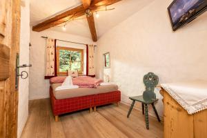 Ένα ή περισσότερα κρεβάτια σε δωμάτιο στο Ferienchalet Katharina