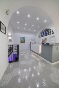 a room with a hallway with a glass floor at Hotel L'Ariana ISOLE EOLIE - UNA Esperienze in Leni