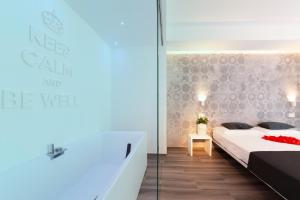 Posteľ alebo postele v izbe v ubytovaní Hotel Mediterraneo Ombrellone e Lettini Inclusi