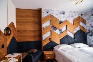 Postel nebo postele na pokoji v ubytování Hotel Cristallo