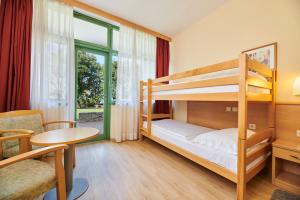 Postel nebo postele na pokoji v ubytování Hotel Aurora Plava Laguna