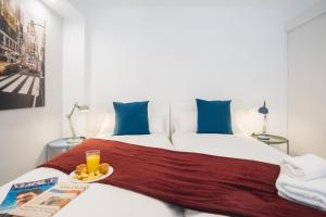 Postel nebo postele na pokoji v ubytování HOMEABOUT RETIRO Apartment II