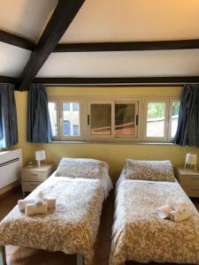 Кровать или кровати в номере Domus Santa Caterina