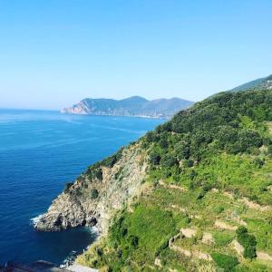 an aerial view of the ocean and a mountain at il Magàn - Cinque Terre in Corniglia