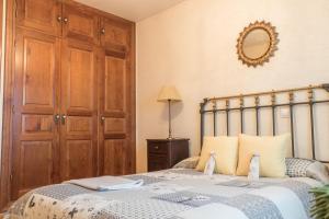 Łóżko lub łóżka w pokoju w obiekcie Casa Rural El Capricho