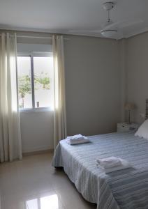 Postel nebo postele na pokoji v ubytování Residencial Mediterráneo