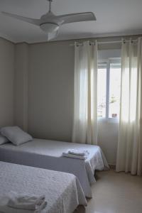 Postel nebo postele na pokoji v ubytování Residencial Mediterráneo + 30 fotografií