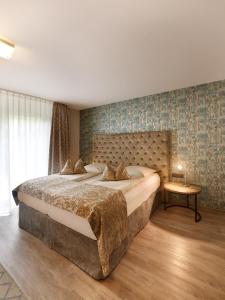 Postel nebo postele na pokoji v ubytování Art Hotel Superior
