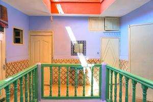 a room with a balcony with a basketball hoop at Hostel Kif-Kif in Marrakesh