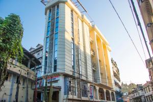 a tall building on the side of a street at Humro Himalayan Orchid in Darjeeling