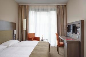 Postel nebo postele na pokoji v ubytování IntercityHotel Berlin Hauptbahnhof