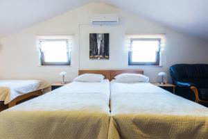 מיטה או מיטות בחדר ב-Villa Tina
