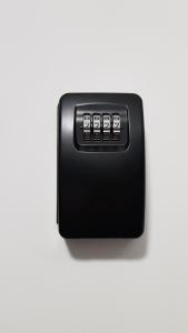 a black toaster on a white background at Apartament Fibra Essenza in Rybnik