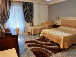 Postel nebo postele na pokoji v ubytování Regina di Saba - Hotel Villa per ricevimenti