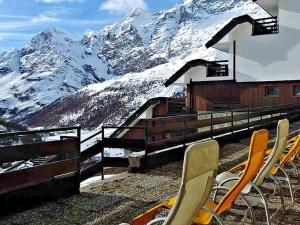a group of chairs sitting in front of a mountain at Cervinia in residence in Breuil-Cervinia