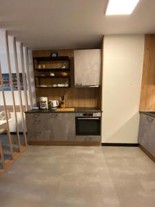 a kitchen with a stove and a counter top at Sigl-Luxuria in Zell am See