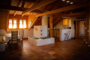 a large room with a kitchen and a living room at Ferienwohnung zum Forsthaus in Oberviechtach