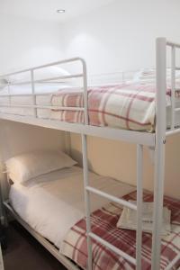 a couple of bunk beds in a room at Ladybird Cottage, Dog Friendly, Couples or Small families, Yorkshire Wolds - Countryside and Coast in Great Driffield