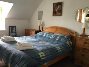 Säng eller sängar i ett rum på Valtos 23 Isle of Lewis