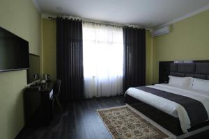 Postel nebo postele na pokoji v ubytování Hotel 777