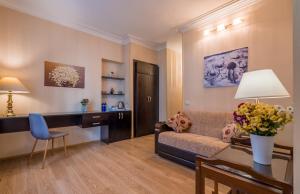 a living room with a couch and a table at Iliani Hotel in Tbilisi City