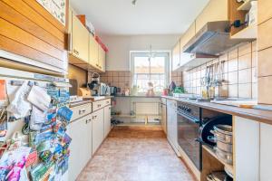 a kitchen with a sink and a dishwasher at Private Apartment Smoker in Hannover