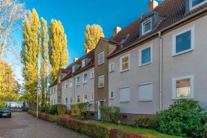 a row of houses on a street at Private Apartment in Hannover