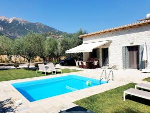 The swimming pool at or close to Alexandros Stone House