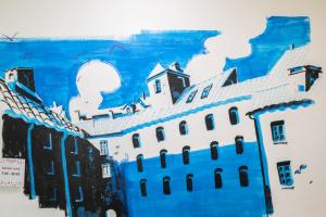 a painting of a white building on a wall at Ostello San Filippo Neri in Modena