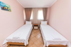 Postel nebo postele na pokoji v ubytování Hotel Heritage