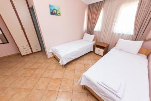 Postel nebo postele na pokoji v ubytování Hotel Heritage