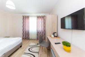 TV a/nebo společenská místnost v ubytování Hotel Heritage
