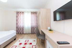 TV a/nebo společenská místnost v ubytování Hotel Heritage + 26 fotografií