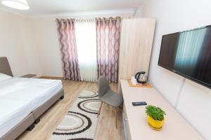 TV a/nebo společenská místnost v ubytování Hotel Heritage