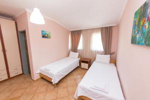 Postel nebo postele na pokoji v ubytování Hotel Heritage