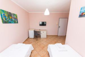Postel nebo postele na pokoji v ubytování Hotel Heritage