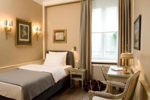 Postel nebo postele na pokoji v ubytování Boutique Hotel Splendid