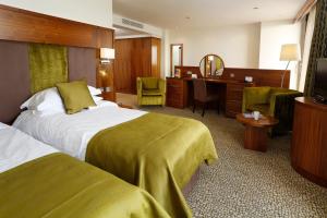 Ένα ή περισσότερα κρεβάτια σε δωμάτιο στο The View Hotel