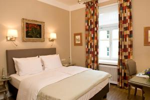Postel nebo postele na pokoji v ubytování Boutique Hotel Splendid