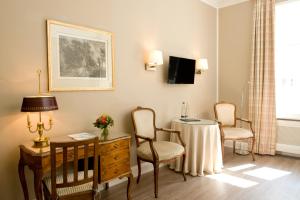 TV a/nebo společenská místnost v ubytování Boutique Hotel Splendid
