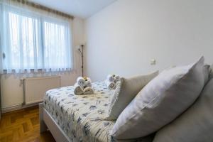 Postel nebo postele na pokoji v ubytování Apartment Jarun Brac