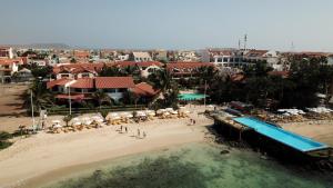 an aerial view of a beach with a water slide at Oceanfront Apartment 4 Porto Antigo II in Santa Maria
