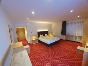 Ένα ή περισσότερα κρεβάτια σε δωμάτιο στο Hotel Mignon