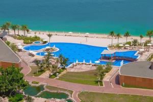 an aerial view of a resort with a pool and the beach at Andaz Residence by Hyatt - Palm Jumeirah in Dubai