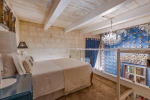 Ένα ή περισσότερα κρεβάτια σε δωμάτιο στο Valletta Lucente Guest House
